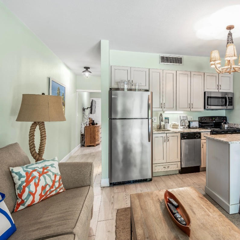 One-bedroom condo at Silver Dunes in Destin, Florida featuring an open living area and fully equipped kitchen.