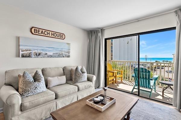Silver Dunes townhouse rental living room with balcony and Gulf view